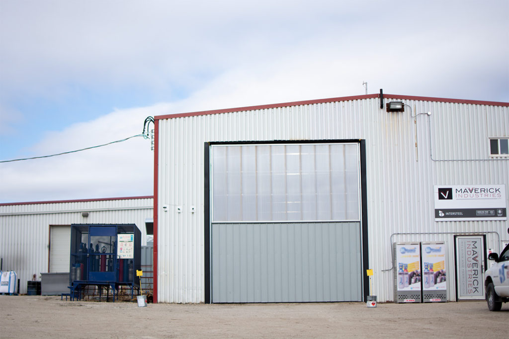 industrial welding shop with commercial bifold door