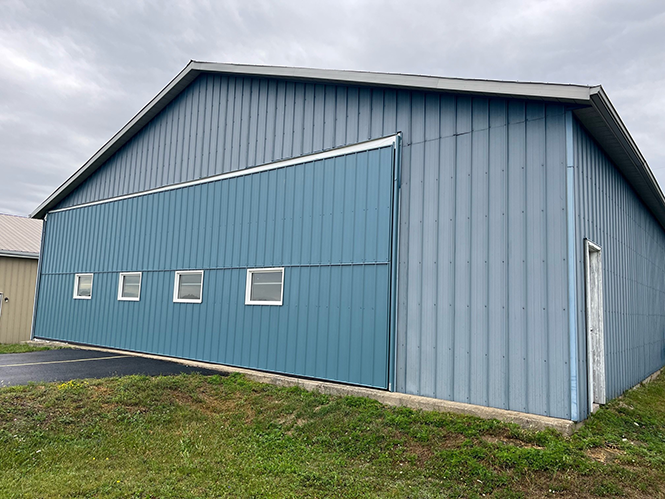 wood building private hangar door with windows