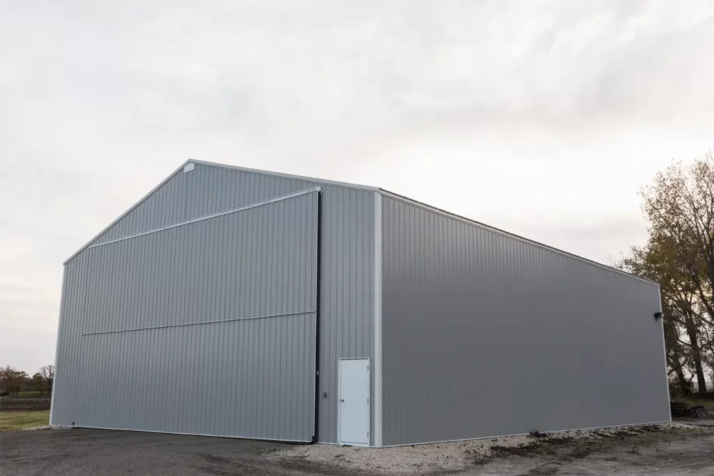 cold storage wood building with large commercial bifold door