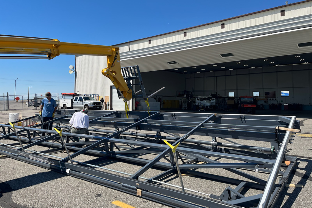 hangar door install with crane commercial hanagr