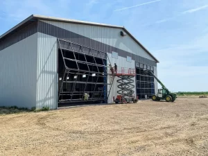 Installing a bifold door on a large shop