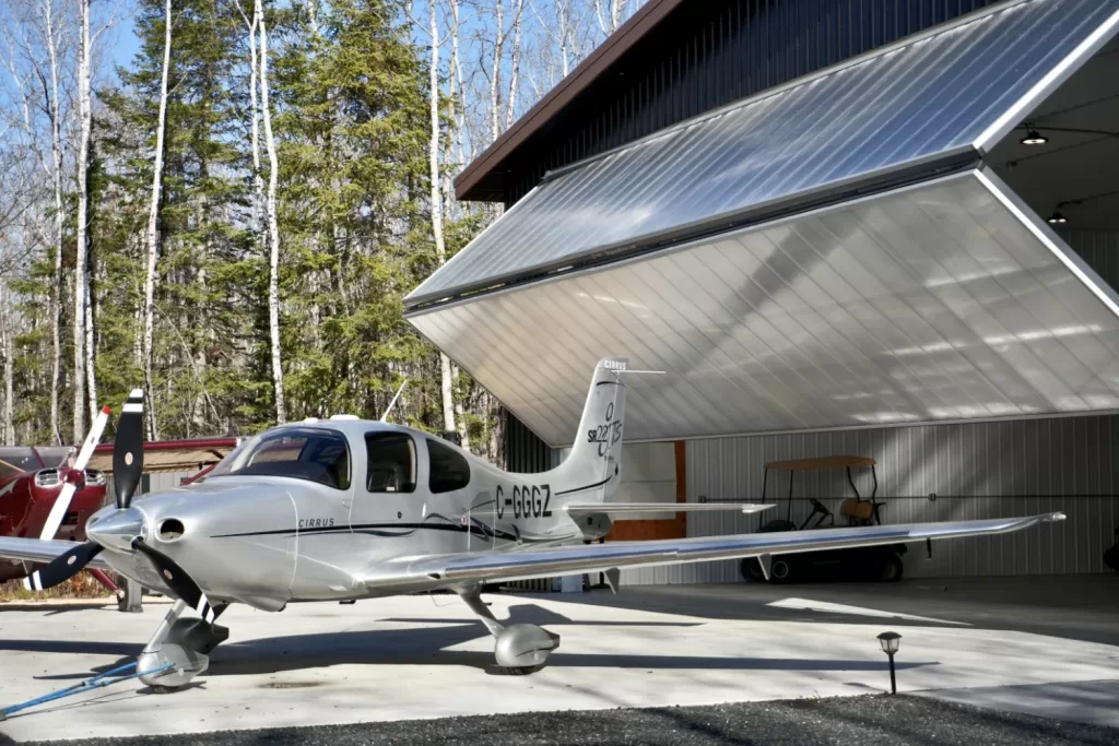 Plane in front of a Diamond bifold door