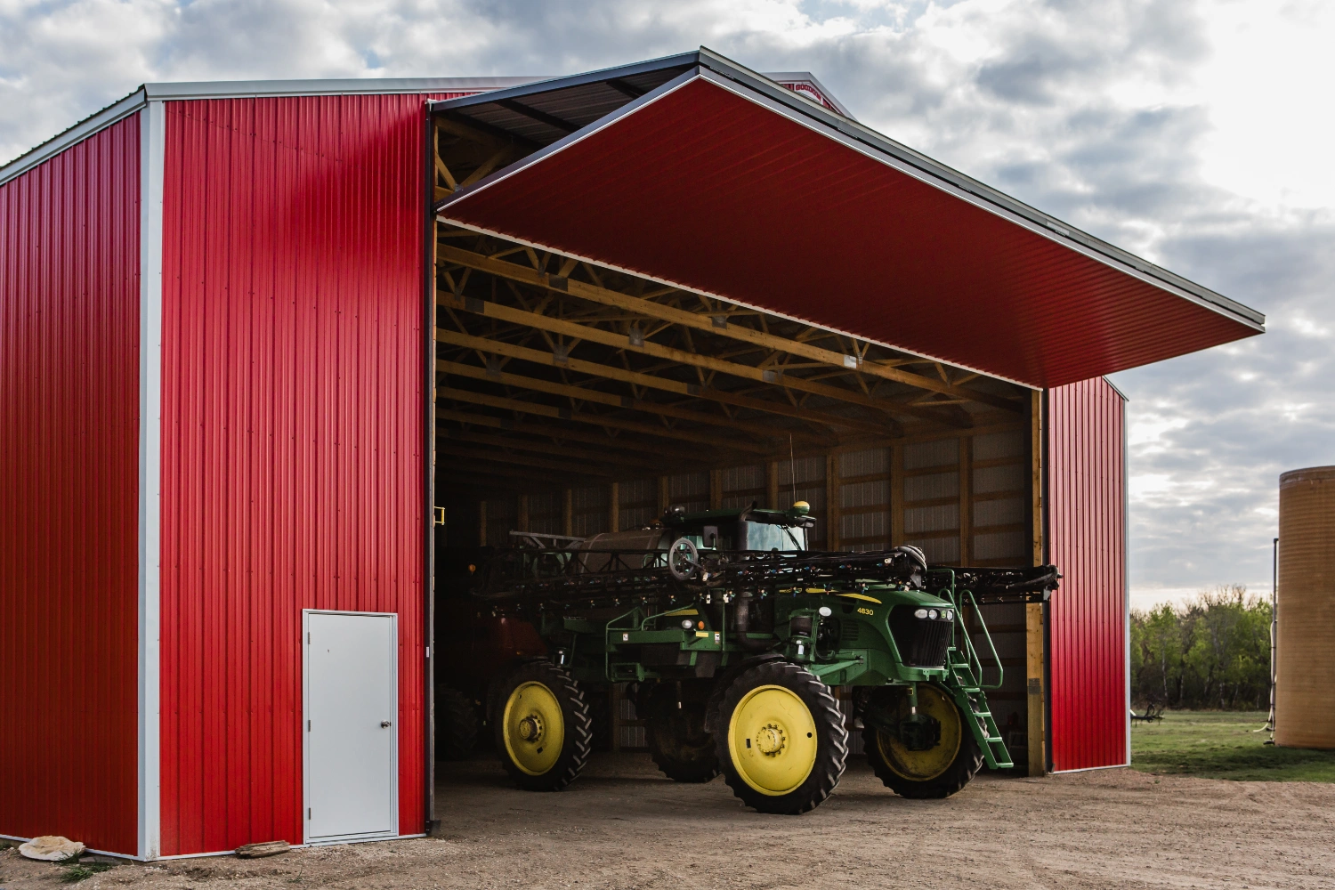 John Deere sprayer in shed with diamond bifold door